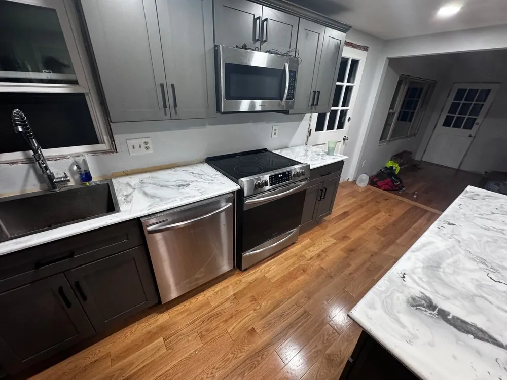 Gray kitchen cabinet remodeling and countertop work by 24-7 Handyman LLC in Hillsborough County NH Gray kitchen cabinet remodeling and countertop work by 24-7 Handyman LLC in Hillsborough County NH